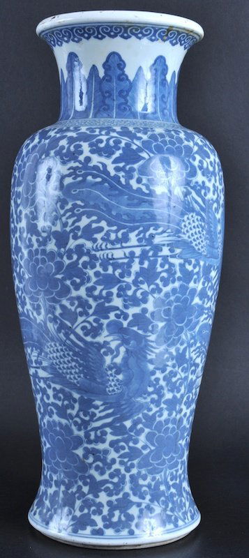 AN 18TH CENTURY CHINESE BLUE AND WHITE VASE Late: AN 18TH CENTURY CHINESE BLUE AND WHITE VASE Late Qianlong, painted with birds amongst boldly sprayed foliage and roundels. Drilled.17.5ins high.