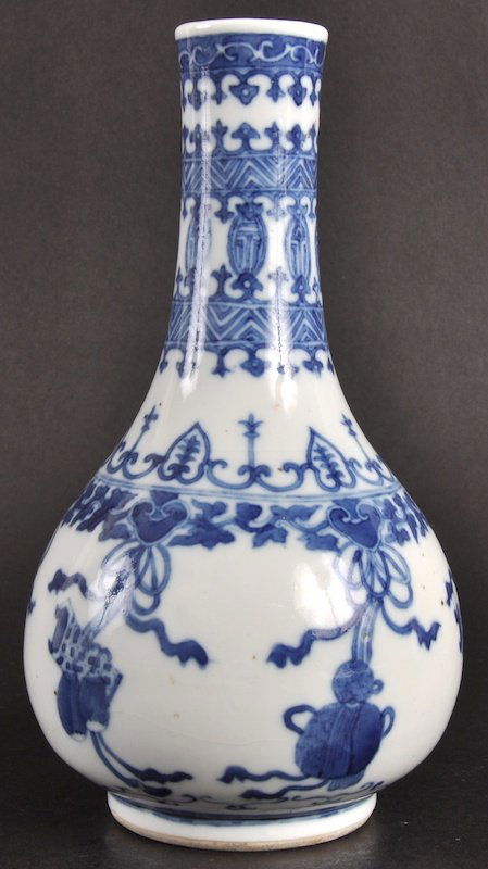 A 19TH CENTURY CHINESE BLUE AND WHITE BULBOUS VA: A 19TH CENTURY CHINESE BLUE AND WHITE BULBOUS VASE bearing Kangxi marks to base, painted with precious objects. Glaze flaw to body.8.5ins high.