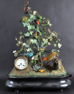 A RARE 19TH CENTURY FRENCH AUTOMATON BONTEMPS CL: A RARE 19TH CENTURY FRENCH AUTOMATON BONTEMPS CLOCK of naturalistic form, each bird moving in amongst the foliage and drinking from the imitation stream. 2ft 4ins overall x 1ft 5ins wide.