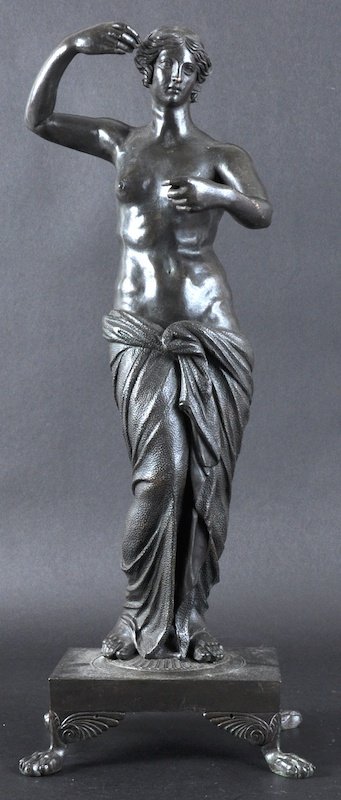 A 19TH CENTURY EUROPEAN BRONZE FIGURE OF APHRODIT: A 19TH CENTURY EUROPEAN BRONZE FIGURE OF APHRODITE modelled upon a square plinth. 18. 75ins high.