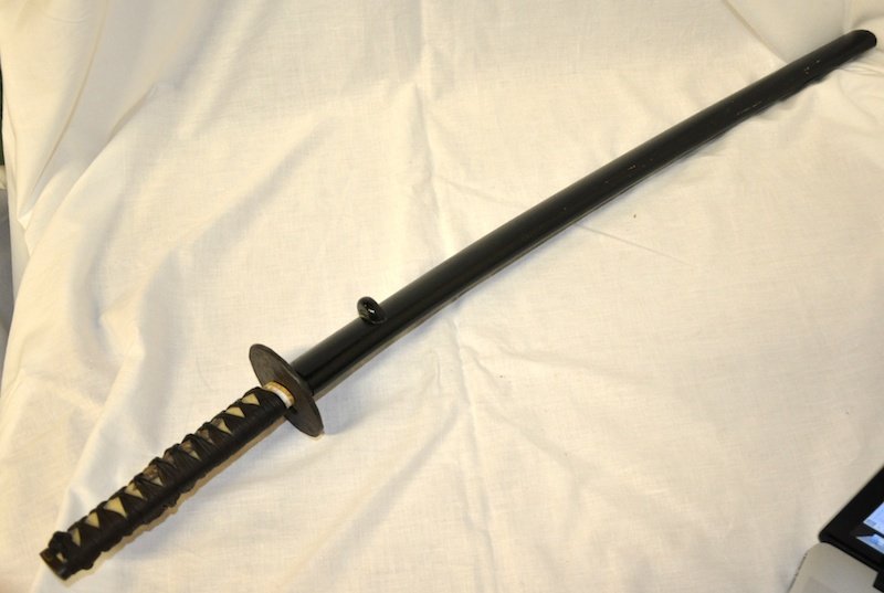 A JAPANESE SAMURAI SWORD with signed handle with : A JAPANESE SAMURAI SWORD with signed handle with shagreen in a lacquered case. 34ins long.