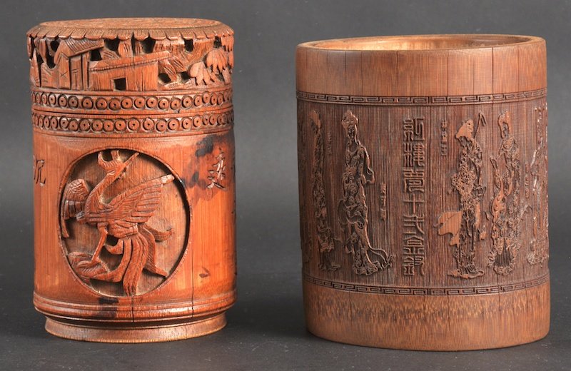 A 19TH CENTURY CHINESE CARVED BAMBOO BRUSH POT to: A 19TH CENTURY CHINESE CARVED BAMBOO BRUSH POT together with another brush pot & cover, decorated with calligraphy. Natural splits. 5. 5ins & 5ins high. (2)