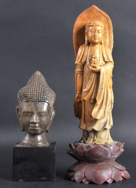 A LATE 19TH CENTURY CHINESE SOAPSTONE FIGURE OF A: A LATE 19TH CENTURY CHINESE SOAPSTONE FIGURE OF A BUDDHA together with a carved soapstone Buddhist head. Minor nicks. 11. 5ins & 6ins high. (2)