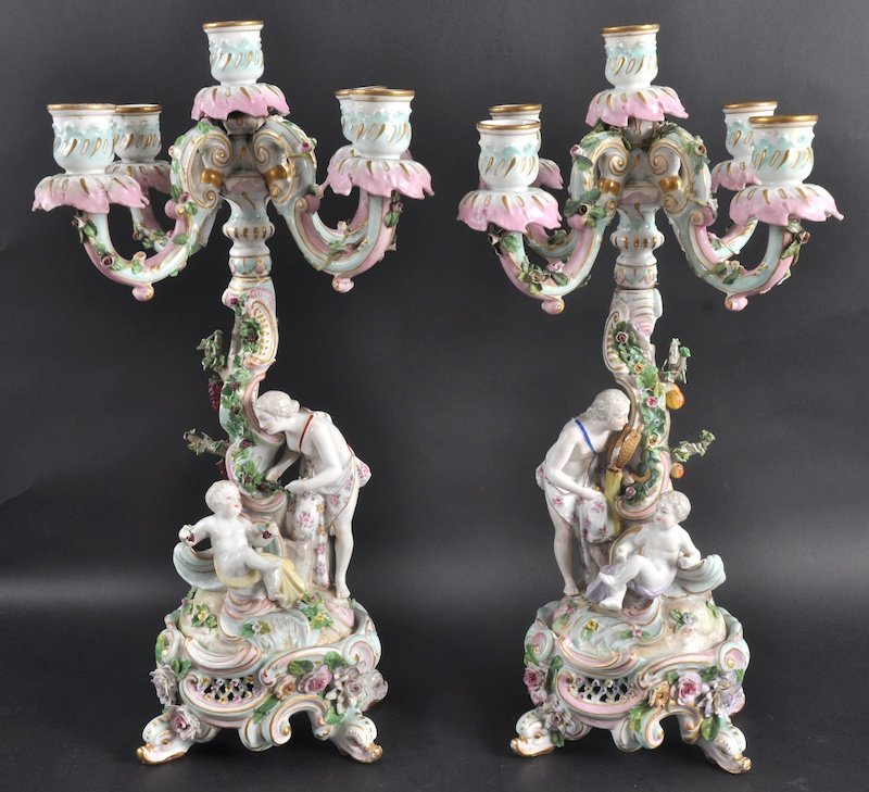 A PAIR OF LATE 19TH CENTURY GERMAN PORCELAIN CAND: A PAIR OF LATE 19TH CENTURY GERMAN PORCELAIN CANDLEABRA formed with classical figures upon a rococo base. 1ft 5ins high.