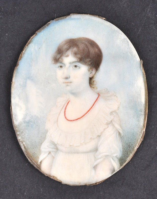 A 19TH CENTURY ENGLISH PORTRAIT MINIATURE ON IVOR: A 19TH CENTURY ENGLISH PORTRAIT MINIATURE ON IVORY depicting a young girl wearing a red necklace. 2. 25ins wide.