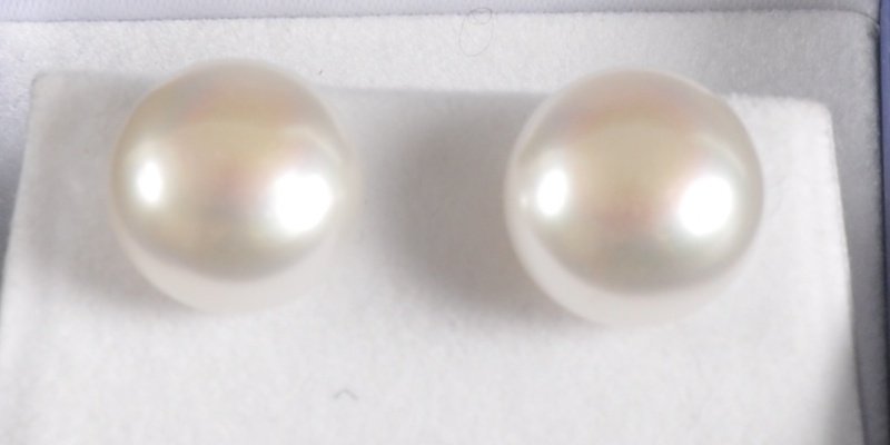 A PAIR OF 14CT WHITE GOLD 13MM PEARL EAR STUDS. : A PAIR OF 14CT WHITE GOLD 13MM PEARL EAR STUDS.