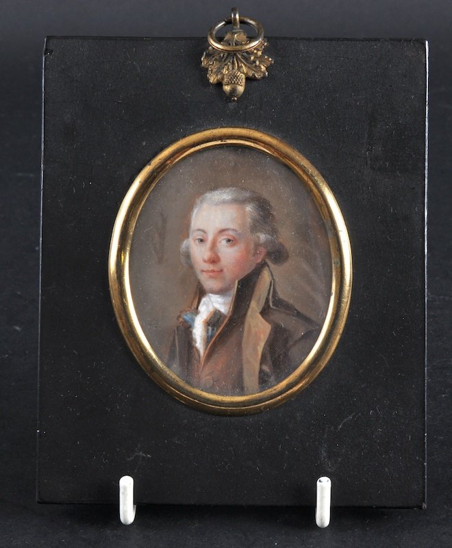 A GOOD EARLY 19TH CENTURY ENGLISH PORTRAIT MINIAT: A GOOD EARLY 19TH CENTURY ENGLISH PORTRAIT MINIATURE depicting a young gentleman within an ebonised frame. Signed FD. Image 2. 25ins wide.