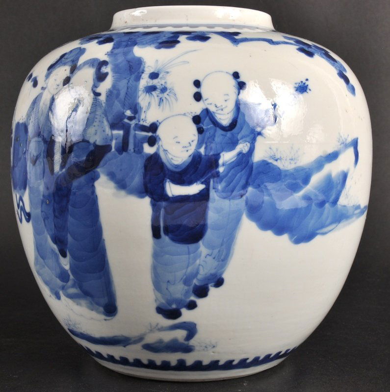 A 19TH CENTURY CHINESE BLUE AND WHITE GINGER JAR: A 19TH CENTURY CHINESE BLUE AND WHITE GINGER JAR bearing Kangxi marks to base, painted with children and females within a landscape. Small hairline to body. 6. 75ins wide.