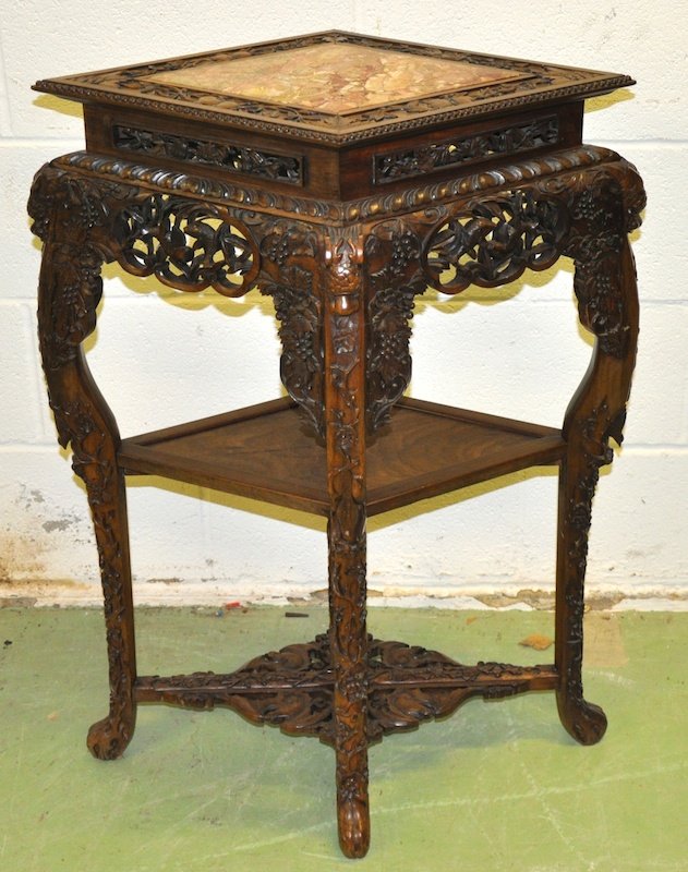 A FINE 19TH CENTURY CHINESE HARDWOOD LOZENGE SHAP: A FINE 19TH CENTURY CHINESE HARDWOOD LOZENGE SHAPED TABLE with inset marble top, well carved with fish, dragons and bats. Minor faults. 3ft 1ins x 2ft 1ins.