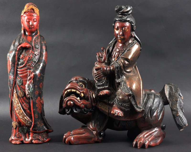 AN EARLY 20TH CENTURY CHINESE LACQUERED WOOD FIGU: AN EARLY 20TH CENTURY CHINESE LACQUERED WOOD FIGURE OF GUANYIN modelled upon a kylin, together with a figure of guanyin. Minor faults. 14ins & 15.5ins high. (2)