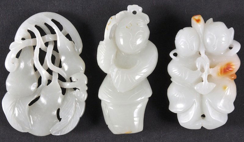 AN EARLY 20TH CENTURY CHINESE WHITE JADE CARVED FI: AN EARLY 20TH CENTURY CHINESE WHITE JADE CARVED FIGURE OF TWO BOYS together with another jade figure & plaque. Natural flaws. (3)