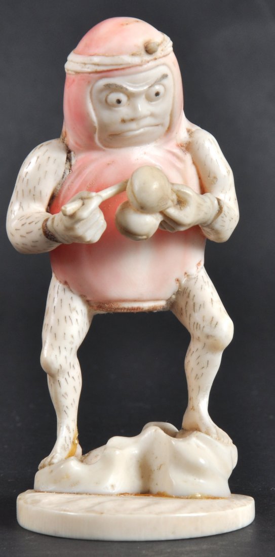 AN UNUSUAL EARLY 20TH CENTURY JAPANESE IVORY FIGUR: AN UNUSUAL EARLY 20TH CENTURY JAPANESE IVORY FIGURE OF A ZOOMORPHIC MALE modelled upon a shape dplinth. Hand & base re stuck. Signed.4.5ins high.