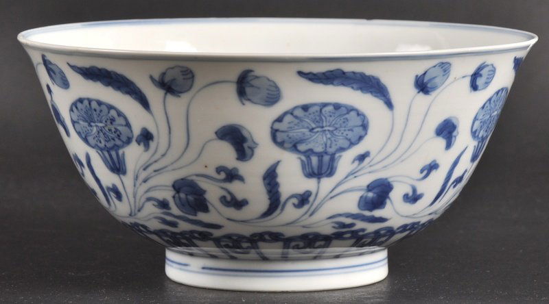 A CHINESE KANGXI PORCELAIN BLUE AND WHITE BOWL be: A CHINESE KANGXI PORCELAIN BLUE AND WHITE BOWL bearing Chenghua marks to base, painted with foliage. Nicks and hairlines.6.5ins diameter.