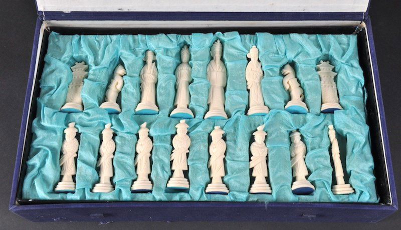 A CHINESE CARVED BONE CHESS SET.: A CHINESE CARVED BONE CHESS SET.