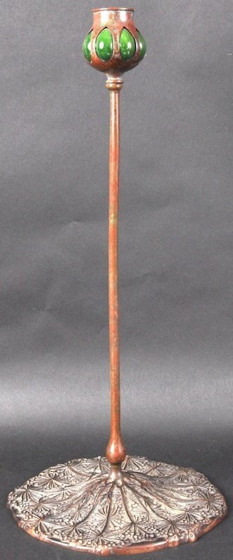 A TIFFANY STUDIO OF NEW YORK BRONZE CANDLESTICK,: A TIFFANY STUDIO OF NEW YORK BRONZE CANDLESTICK, the top unusual tulip type bronze and porcelain holder (AF). 18ins high.