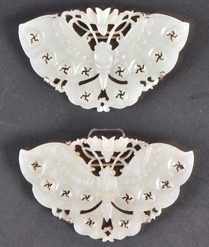 A PAIR OF 19TH CENTURY CHINESE WHITE JADE BUTTERFL: A PAIR OF 19TH CENTURY CHINESE WHITE JADE BUTTERFLIES mounted in white metal. Good condition. 2. 75ins wide.