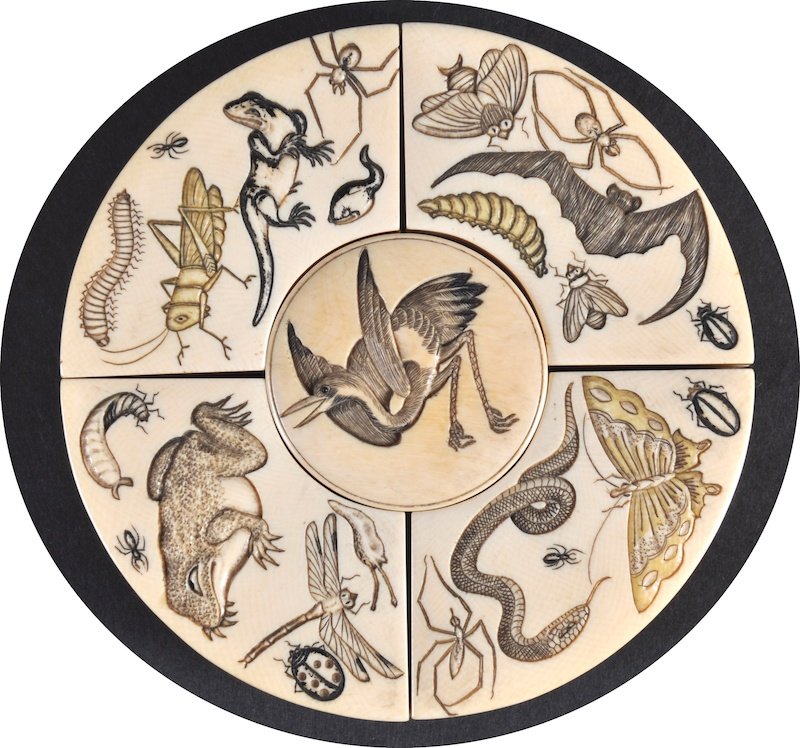 A 19TH CENTURY JAPANESE MEIJI PERIOD IVORY FIVE S: A 19TH CENTURY JAPANESE MEIJI PERIOD IVORY FIVE SECTION BOX carved with insects, frogs, snakes and butterflies. Good condition. 3. 75ins diameter.
