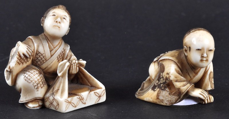 A 19TH CENTURY JAPANESE MEIJI PERIOD IVORY NETSUKE: A 19TH CENTURY JAPANESE MEIJI PERIOD IVORY NETSUKE together with another. Signed. Few losses. (2)