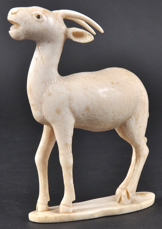 A LATE 19TH CENTURY JAPANESE MEIJI PERIOD IVORY RA: A LATE 19TH CENTURY JAPANESE MEIJI PERIOD IVORY RAM well carved upon a shaped base. Lacking ear. 3. 5ins wide.