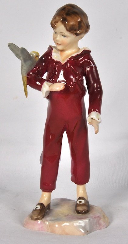 A ROYAL WORCESTER FIGURE “THE PARAKEET”, Design b: A ROYAL WORCESTER FIGURE “THE PARAKEET”, Design by F. C. DOUGHTY, No. 3087. 6. 5ins high.