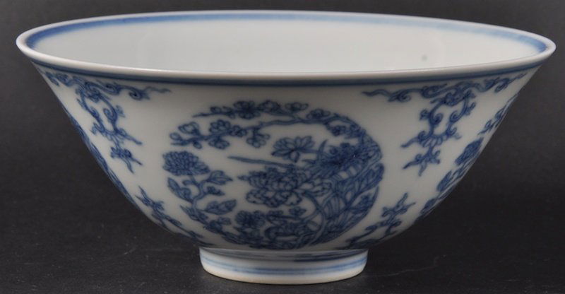 A CHINESE BLUE AND WHITE CONICAL SHAPED BOWL bear: A CHINESE BLUE AND WHITE CONICAL SHAPED BOWL bearing Jiaqing marks to base, painted with foliage. Good condition. 5.5ins diameter.