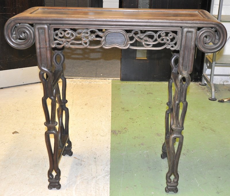 A 19TH CENTURY CHINESE HEAVY HARDWOOD ALTAR TABLE : A 19TH CENTURY CHINESE HEAVY HARDWOOD ALTAR TABLE with foliate carved frieze and organic legs. Signed. Good condition. 3ft 3ins x 1ft 2ins. Provenance: Private British Collection.