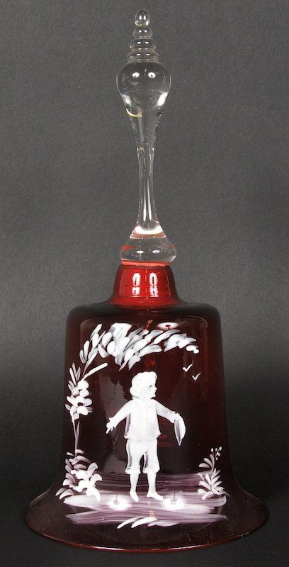 A MARY GREGORY TYPE CRANBERRY BELL painted with a young: A MARY GREGORY TYPE CRANBERRY BELL painted with a young boy. 11ins high.
