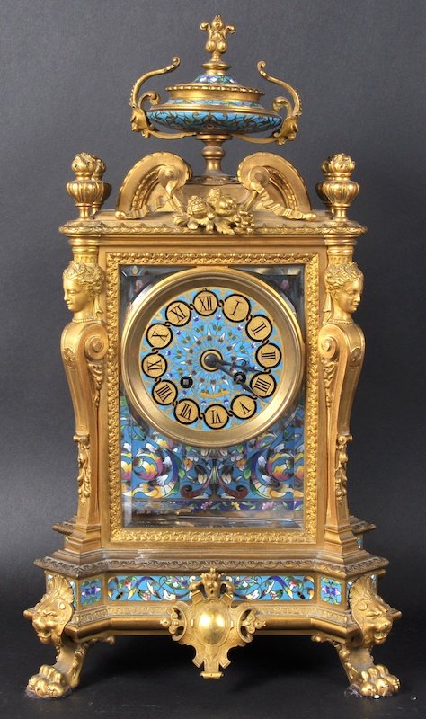 A SUPERB 19TH CENTURY FRENCH ORMOLU AND CHAMPLEVE ENAM: A SUPERB 19TH CENTURY FRENCH ORMOLU AND CHAMPLEVE ENAMEL CLOCK, Retailed by J. W. BENSON, LONDON, BARBEDIENNE FOUNDRY, with urn finial, caryatid female figures and claw feet. 18. 5ins high.