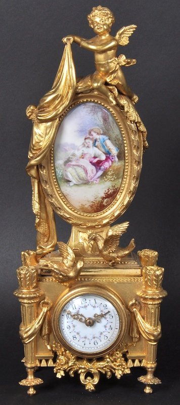 AN UNUSUAL 19TH CENTURY FRENCH BOUDOIR CLOCK, a small : AN UNUSUAL 19TH CENTURY FRENCH BOUDOIR CLOCK, a small circular drum movement in a case, painted circular panel of young lovers, cupid and bird mounts. 12ins high.