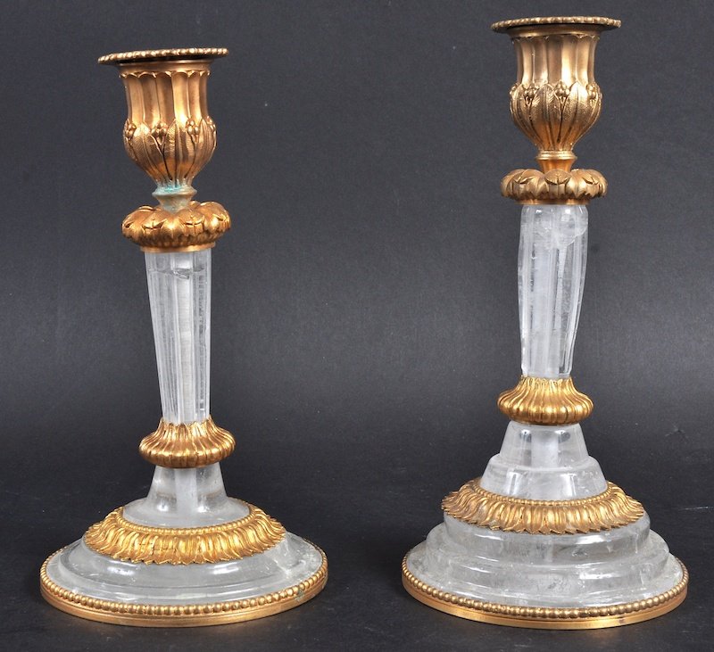 A PAIR OF FRENCH ORMOLU AND ROCK CRYSTAL CANDLESTICKS. : A PAIR OF FRENCH ORMOLU AND ROCK CRYSTAL CANDLESTICKS. 7. 75ins high.