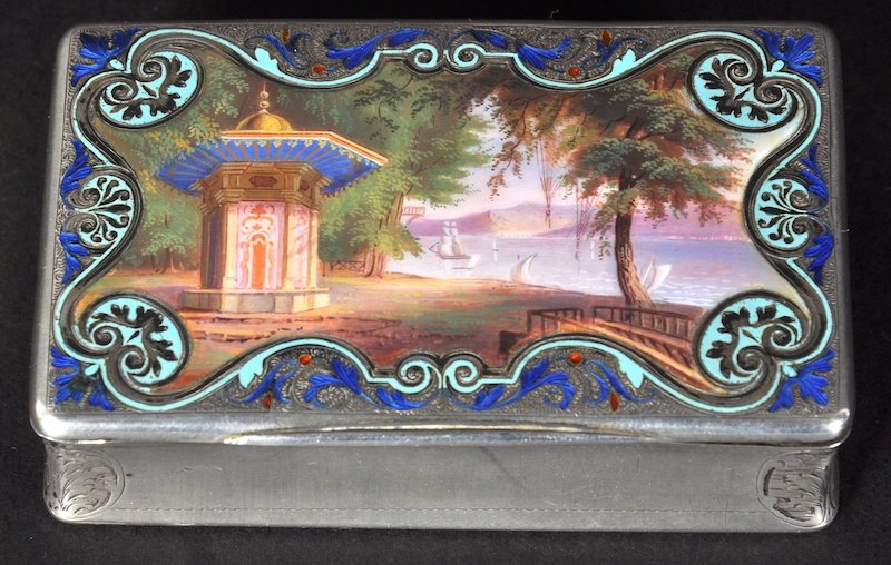 A 19TH CENTURY SILVER AND ENAMEL SNUFF BOX, possibly F: A 19TH CENTURY SILVER AND ENAMEL SNUFF BOX, possibly French, the top with an enamel scene of a Chinese Pagoda overlooking a lake. Provenance: Adele Astaire, sister of Fred Astaire.