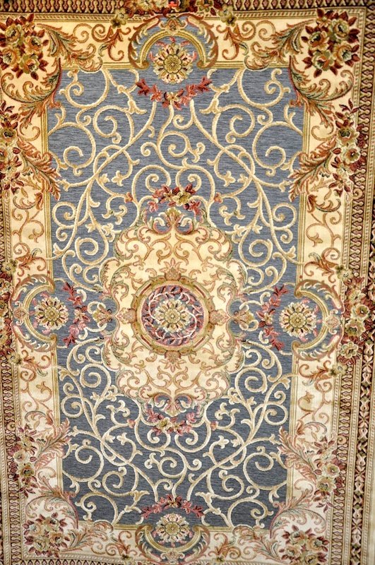 A BLUE GROUND AUBUSSON CARPET, 7ft 6ins x 4ft 11ins. : A BLUE GROUND AUBUSSON CARPET, 7ft 6ins x 4ft 11ins.