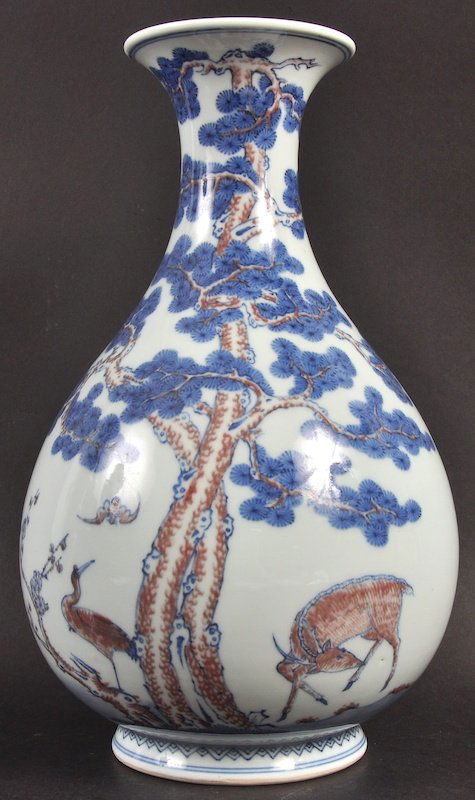 A LOVELY CHINESE BLUE AND WHITE YUHUCHUMPING PORCELAIN : A LOVELY CHINESE BLUE AND WHITE YUHUCHUMPING PORCELAIN VASE Qianlong mark and probably of the period, painted in red enamel with deer and bat within a landscape. Good condition. 12.5ins high.