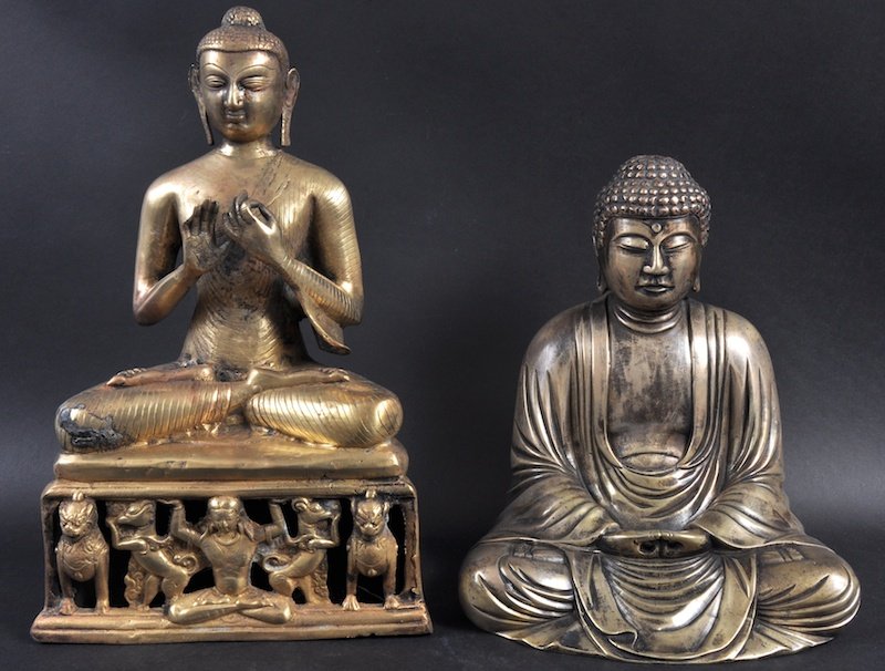 A 19TH CENTURY SOUTH EAST ASIAN BRONZE BUDDHA upon a tr: A 19TH CENTURY SOUTH EAST ASIAN BRONZE BUDDHA upon a triangular base, together with another seated bronze buddha. Surface wear. 14ins & 10.25ins high. (2)