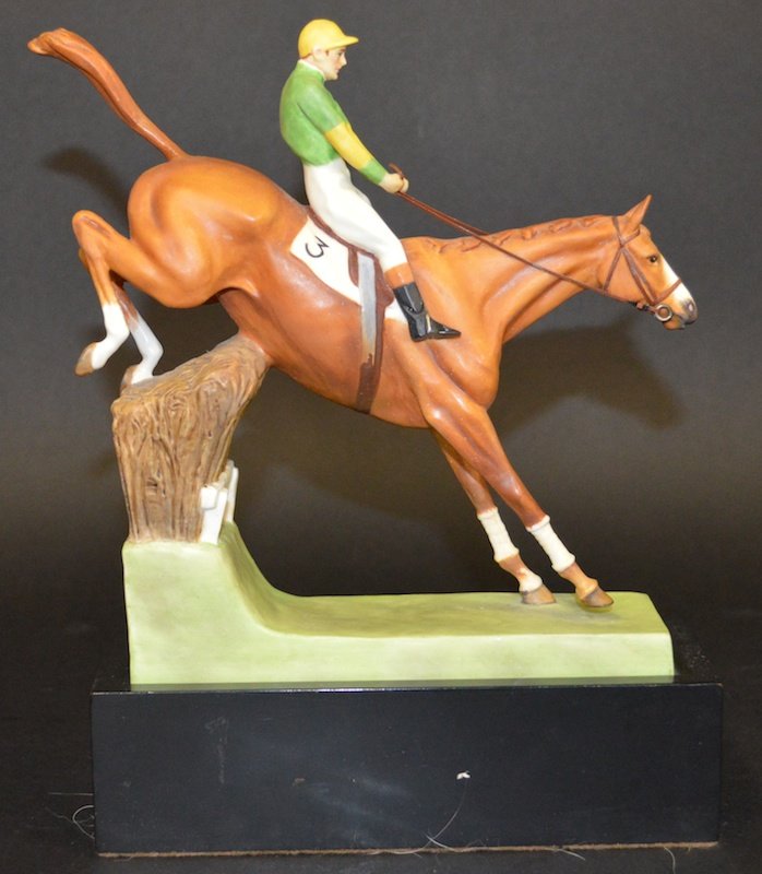 A ROYAL WORCESTER PORCELAIN GROUP, “OVER THE STICKS” b: A ROYAL WORCESTER PORCELAIN GROUP, “OVER THE STICKS” by DORIS LINDNER. 7ins high. No.3116. Complete with original wooden stand.