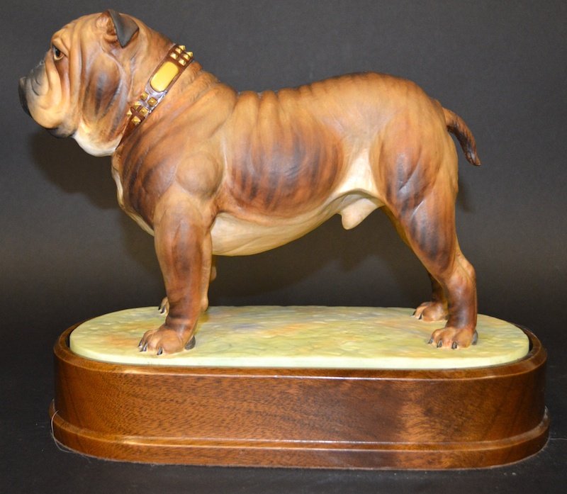 A ROYAL WORCESTER PORCELAIN FIGURE, “THE BULLDOG” by D: A ROYAL WORCESTER PORCELAIN FIGURE, “THE BULLDOG” by DORIS LINDNER, 1968.7.5ins high, on a wooden stand.