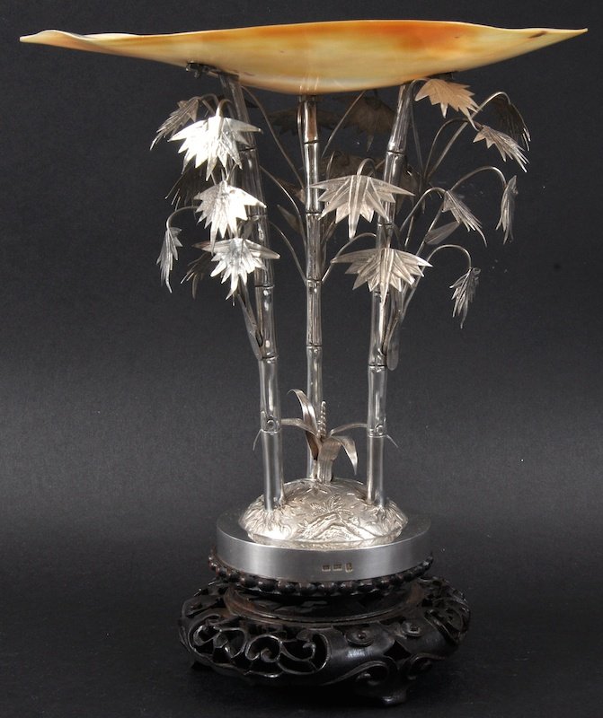 A LOVELY LATE 19TH CENTURY CHINESE EXPORT SILVER AND MO: A LOVELY LATE 19TH CENTURY CHINESE EXPORT SILVER AND MOTHER OF PEARL CENTREPIECE BY WANG HING of naturalistic form. Signed. Good condition. Silver 7.75ins high.