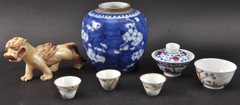 A 19TH CENTURY CHINESE BLUE AND WHITE GINGER JAR paint: A 19TH CENTURY CHINESE BLUE AND WHITE GINGER JAR painted with prunus, together with a hardstone kylin, four teabowls and another Minor faults. (7)