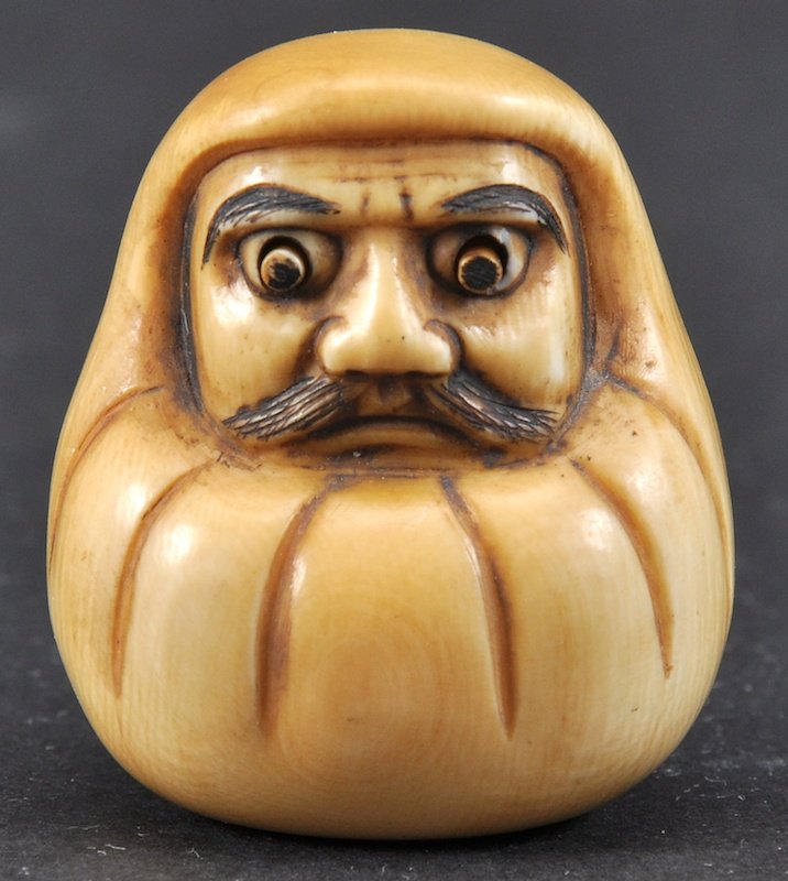 A 19TH CENTURY JAPANESE MEIJI PERIOD IVORY NETSUKE in t: A 19TH CENTURY JAPANESE MEIJI PERIOD IVORY NETSUKE in the form of daruma with popping eyes. Signed. Good condition.15ins high.