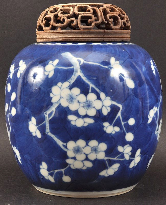 A 19TH CENTURY CHINESE BLUE AND WHITE GINGER JAR bearin: A 19TH CENTURY CHINESE BLUE AND WHITE GINGER JAR bearing Kangxi marks to base, painted with prunus. 8ins high.