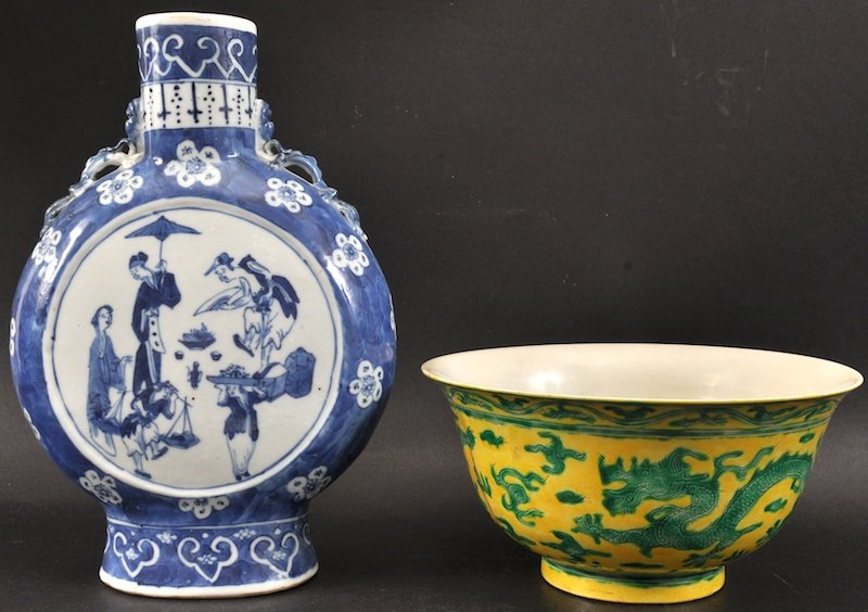 A 19TH CENTURY CHINESE TWIN HANDLED BLUE AND WHITE MOON: A 19TH CENTURY CHINESE TWIN HANDLED BLUE AND WHITE MOON FLASK painted with figures within a landscape, together with a yellow glazed bowl. Rim restoration. 10.25ins high & 7.75ins diameter. (2)