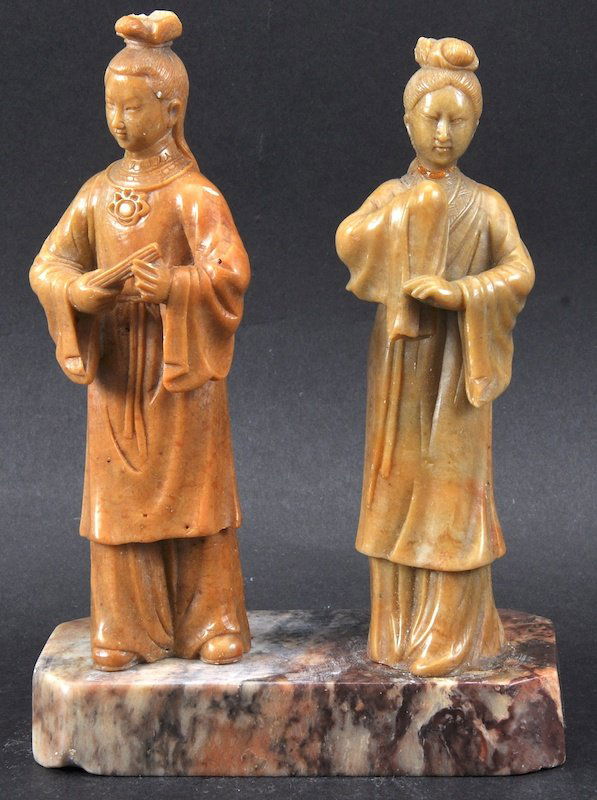 A RARE 19TH CENTURY CHINESE CARVED SOAPSTONE GROUP bear: A RARE 19TH CENTURY CHINESE CARVED SOAPSTONE GROUP bearing Kangxi marks to reverse, modelled upon a rectangular base. One head re attached. 6.75ins high.