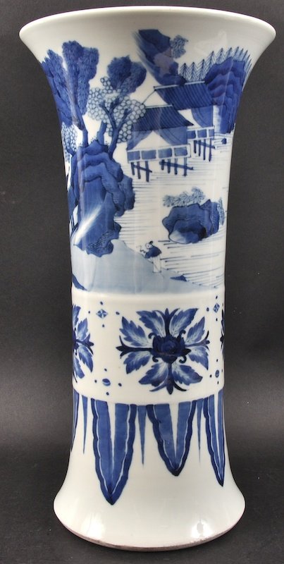 A CHINESE BLUE AND WHITE GU SHAPED PORCELAIN VASE paint: A CHINESE BLUE AND WHITE GU SHAPED PORCELAIN VASE painted with landscapes. Good condition. 14.5ins high.