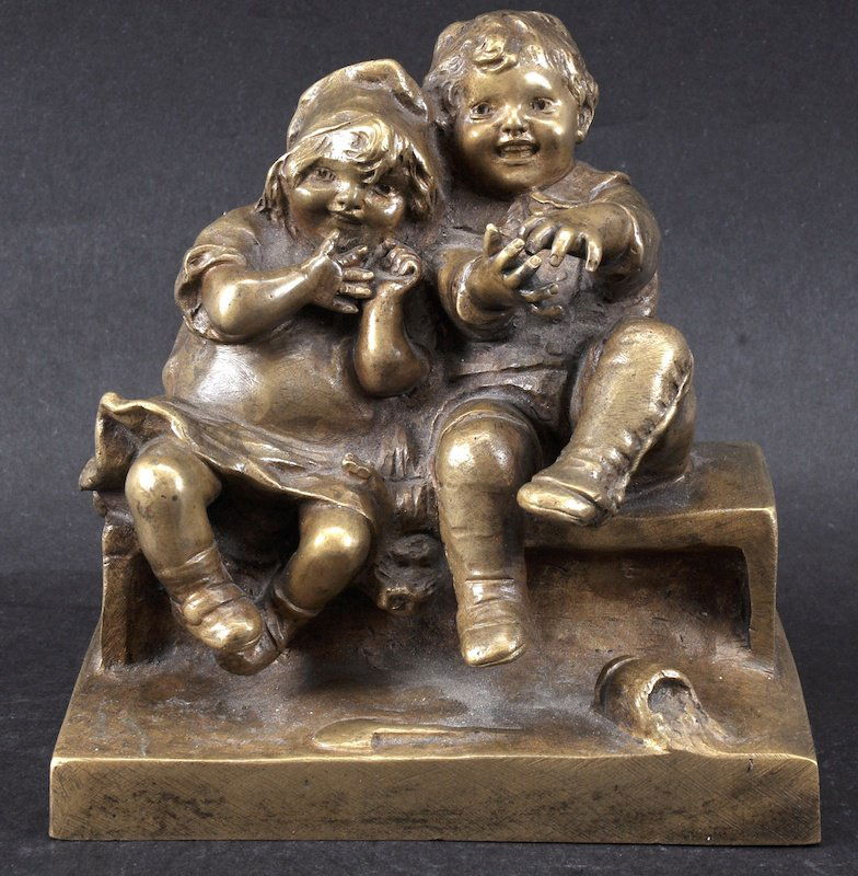 JUAN CLARA (1875-1957) SPANISH A SUPERB GROUP OF TWO CH: JUAN CLARA (1875-1957) SPANISH A SUPERB GROUP OF TWO CHILDREN SITTING ON A BENCH. Signed. 4.5ins wide.