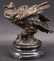 AFTER MILO A SMALL BRONZE FIGURE OF AN OWL. 6.5ins high