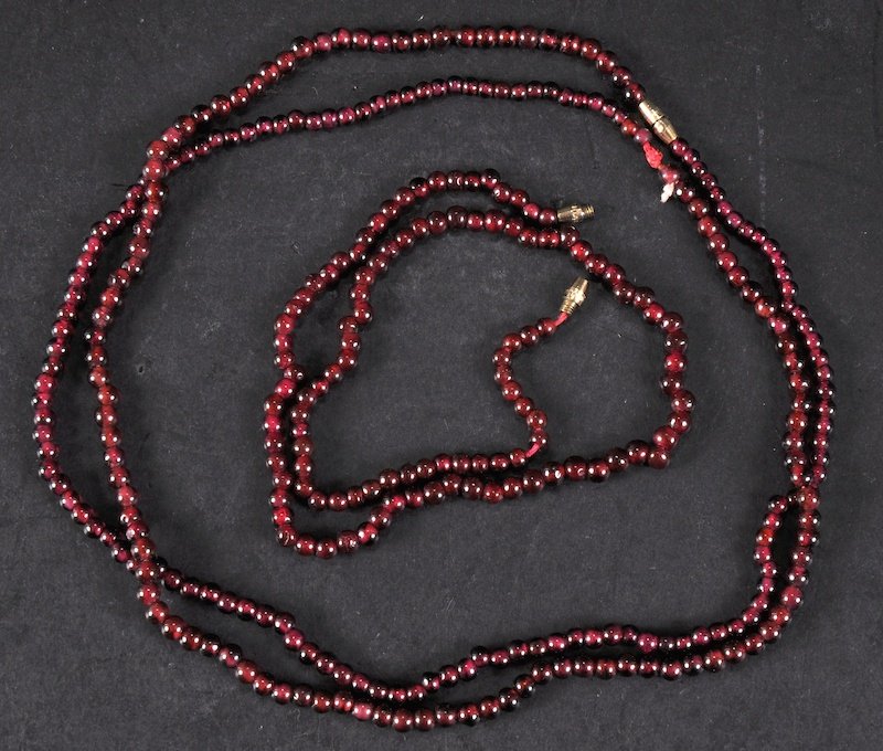 TWO RUBY BEAD NECKLACE.