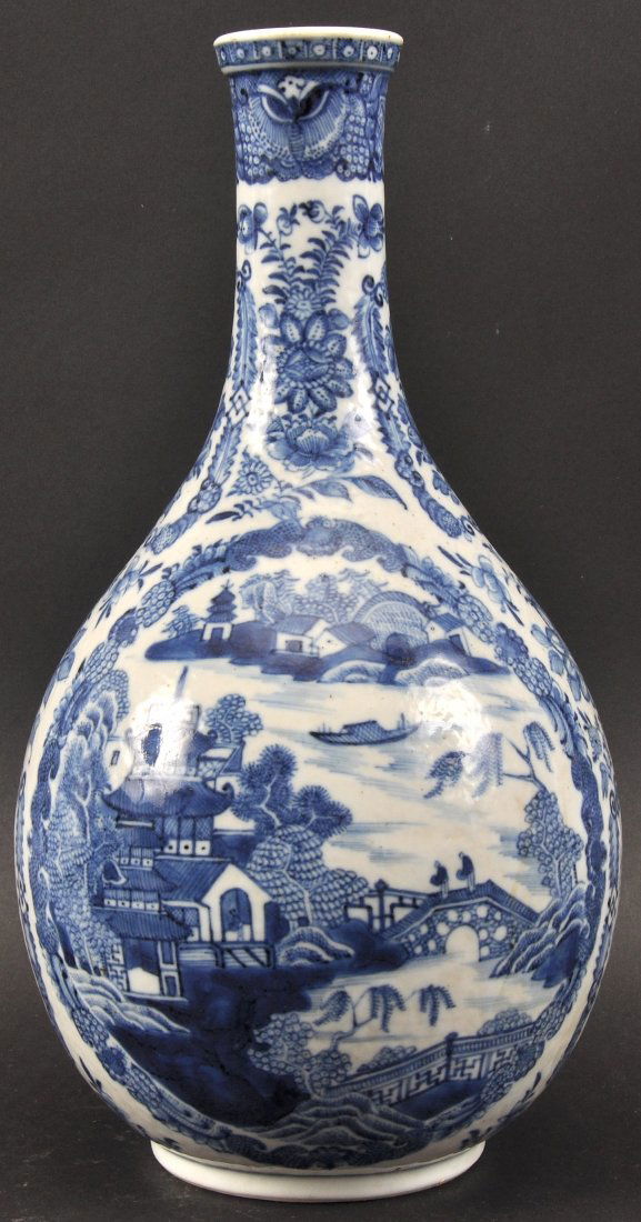 AN 18TH CENTURY CHINESE EXPORT BLUE AND WHITE WATER: AN 18TH CENTURY CHINESE EXPORT BLUE AND WHITE WATER GUGLET Qianlong, painted with buildings upon a river. Hairline to body. 9.75ins high.