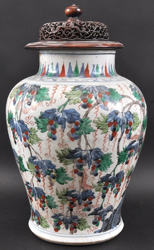 A 17TH CENTURY CHINESE WUCAI PORCELAIN JAR AND COVER: A 17TH CENTURY CHINESE WUCAI PORCELAIN JAR AND COVER Transitional, enamelled with squirrels roaming amongst hanging grape vines. A/F. Jar 14.5ins high.
