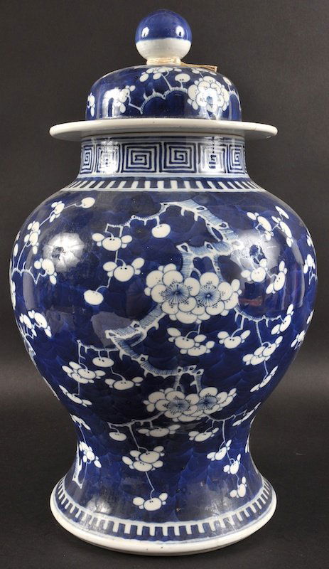 A 19TH CENTURY CHINESE BLUE AND WHITE BALUSTER JAR AND: A 19TH CENTURY CHINESE BLUE AND WHITE BALUSTER JAR AND COVER bearing Kangxi marks to base, painted with flowering trees. Rim repair. 15.5ins high.