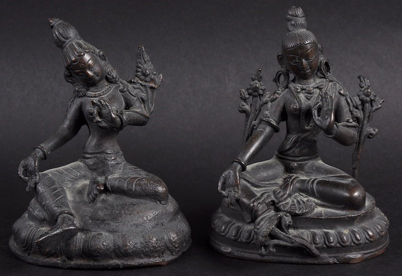 A NEAR PAIR OF 19TH CENTURY SOUTH EAST ASIAN BUDDHAS: A NEAR PAIR OF 19TH CENTURY SOUTH EAST ASIAN BUDDHAS modelled upon triangular base. Minor wear. 3.75ins high.
